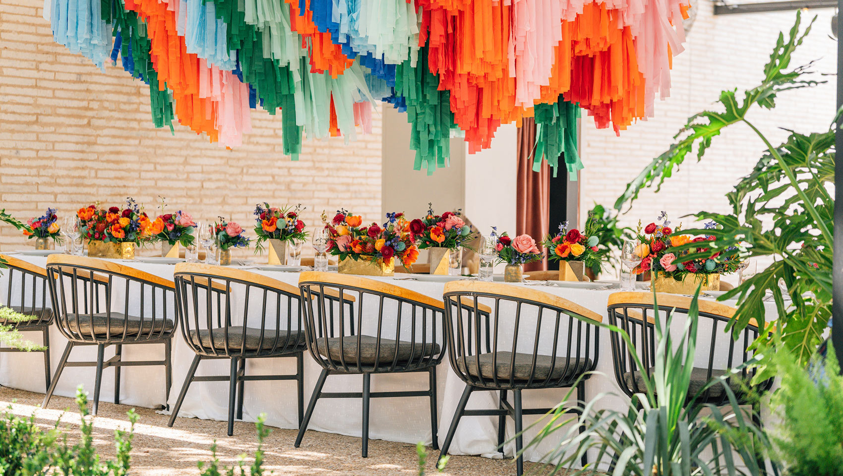decorated chairs at a table with flowers